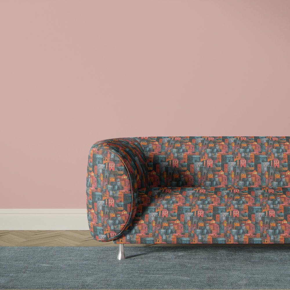 Blue abstract upholstery fabric sofa with geometric cityscape design and layered painterly texture inspired by modernist art