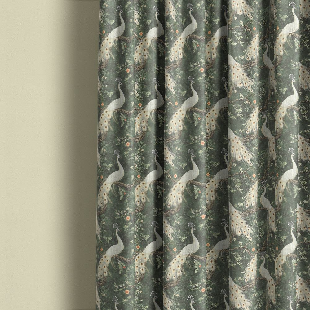 Pavone No.12 linen curtain fabric made into flowing curtains showing white peacock bird design on soft green botanical background