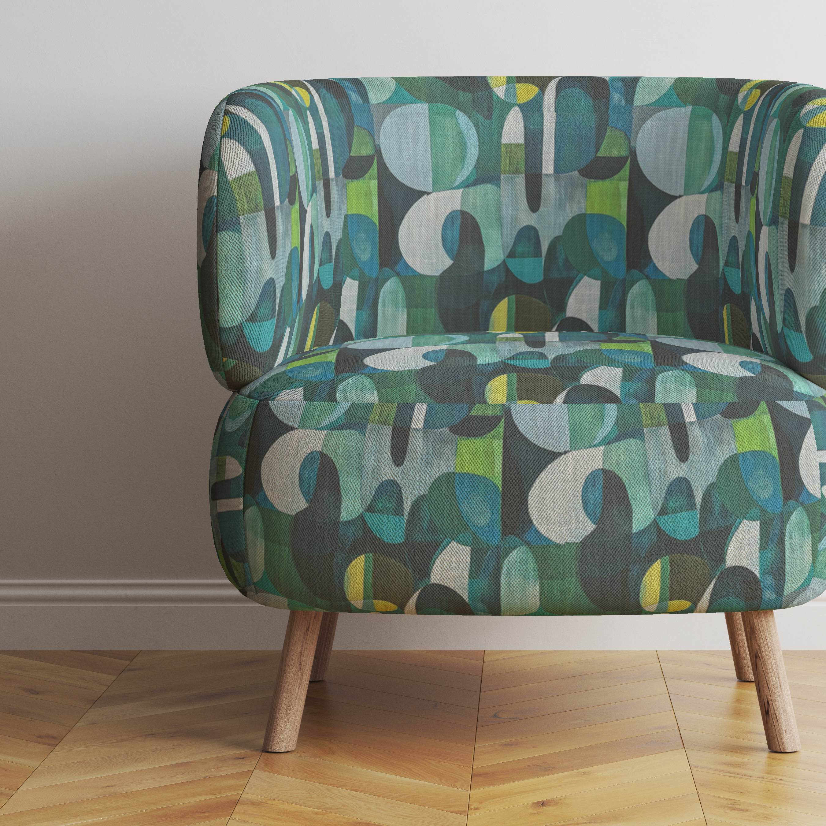 Populist No.12 multicoloured upholstery fabric on curved green armchair in modern interior