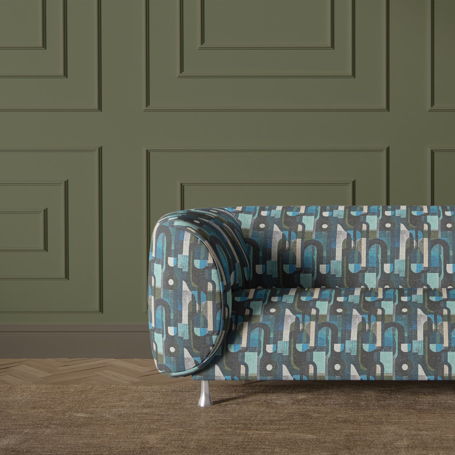 Blue and green Populist No.17 upholstery fabric on modern curved sofa with olive green panelled wall