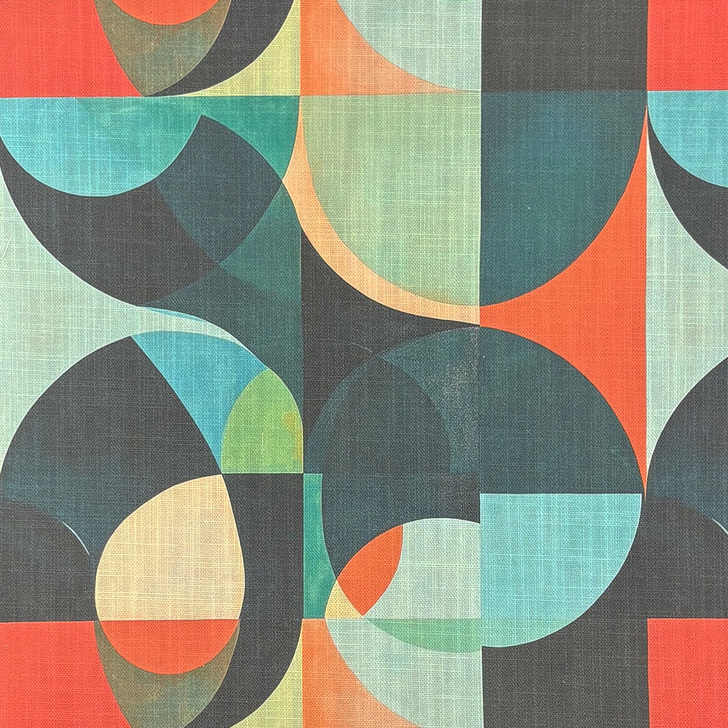 Flat lay of Populist No.8 upholstery fabric with Bauhaus-style pattern in blue, orange, and green