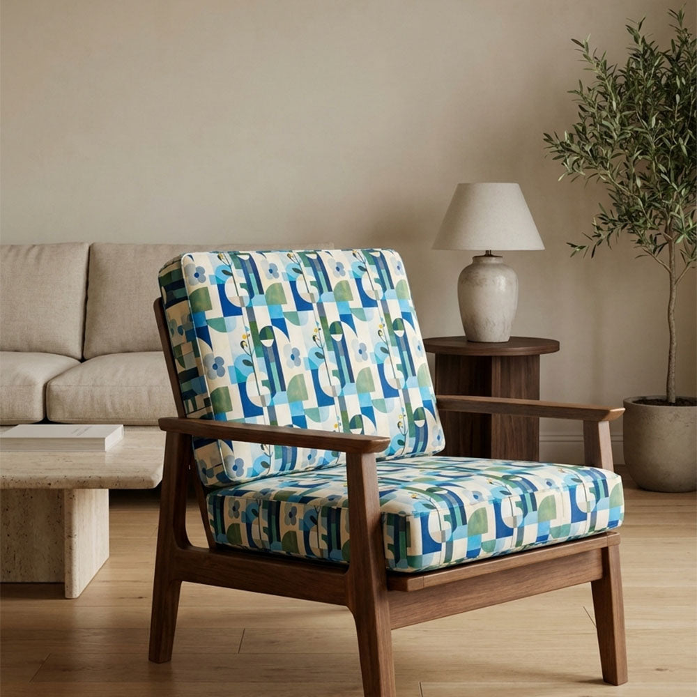 Populist No.15 Crib5 velvet fabric shown on a blue green upholstered chair for statement interiors