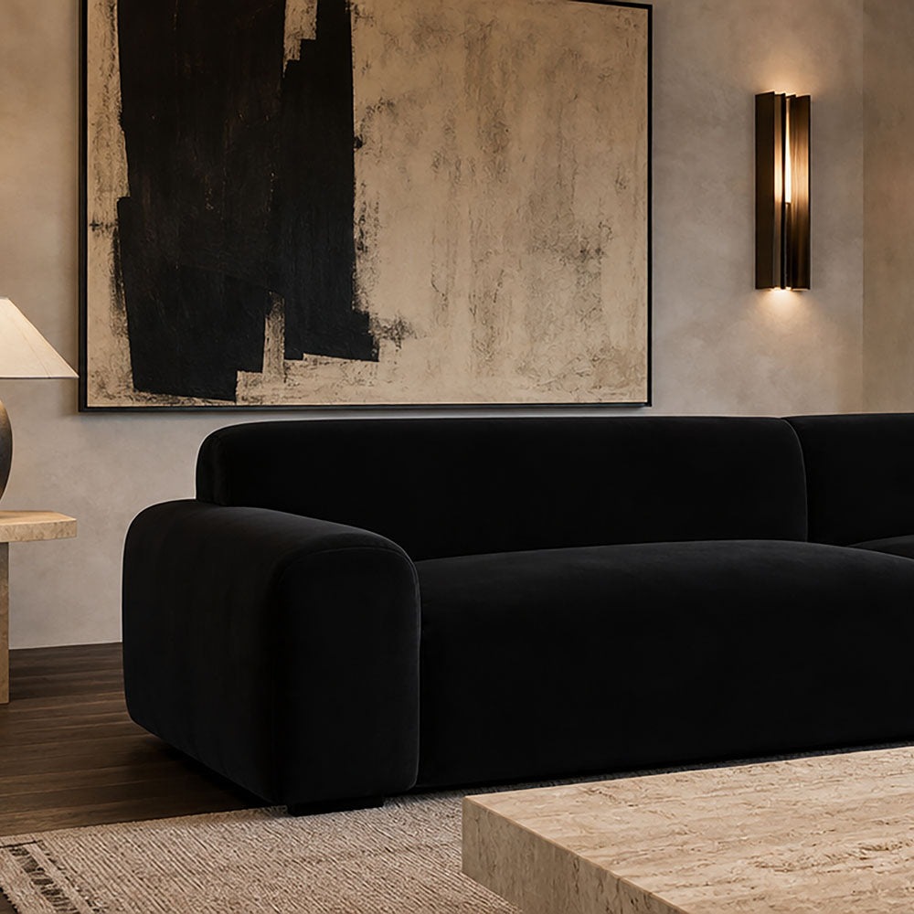 Black sofa upholstered in Portafino upholstery fabric in a contemporary living room