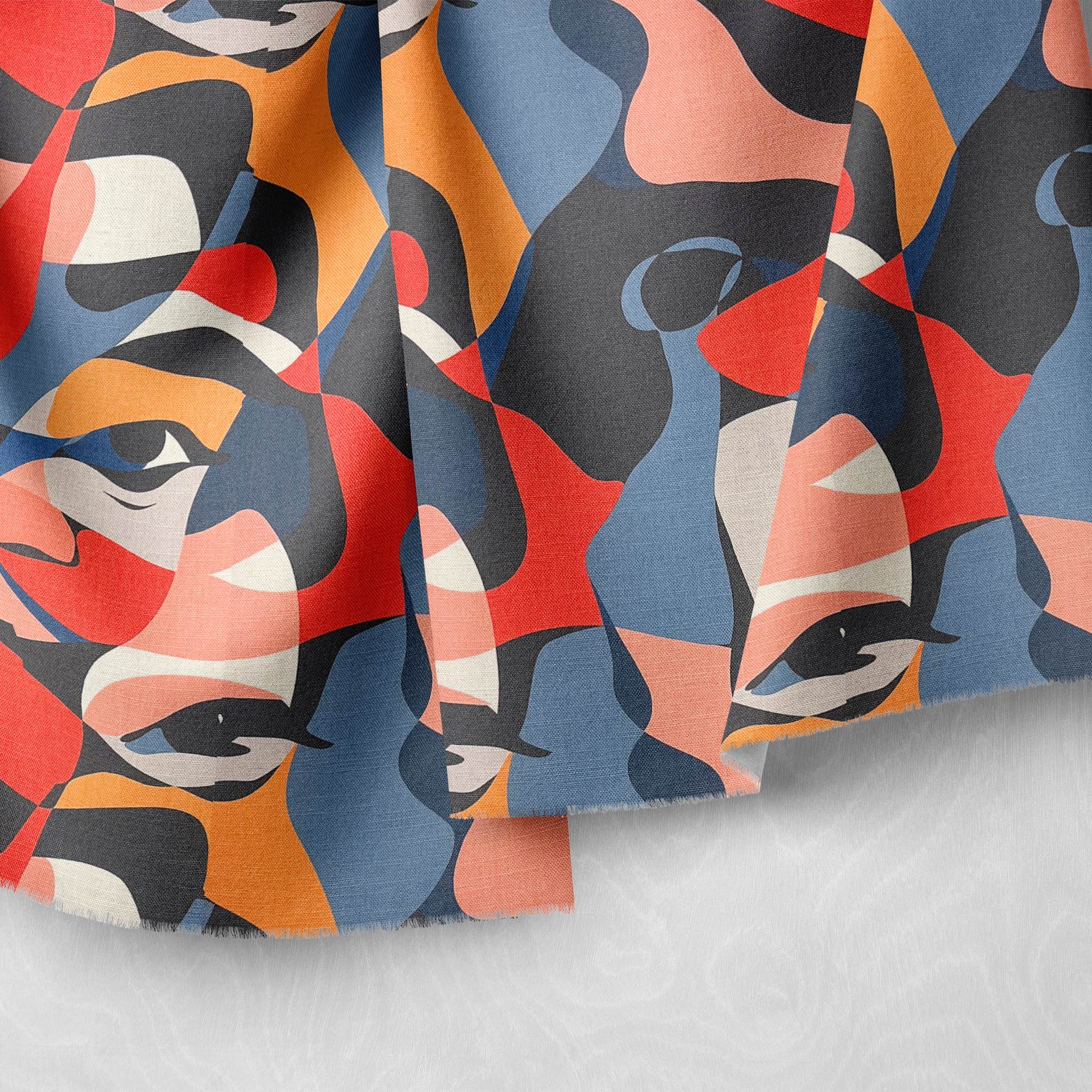 Draped close-up showing artistic face pattern on multicoloured fabric for interiors