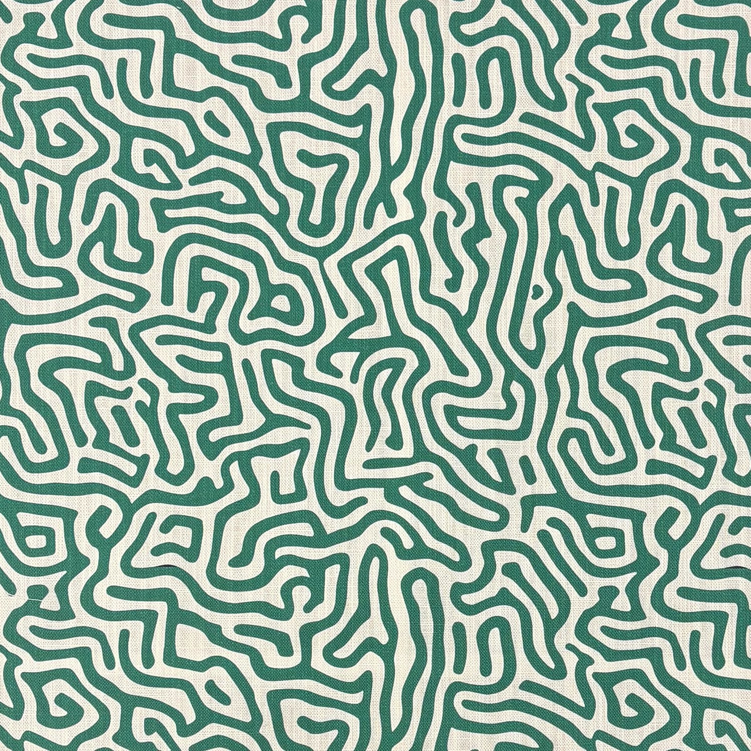 Green abstract linen curtain fabric with flowing maze inspired printed pattern on natural textured linen basecloth