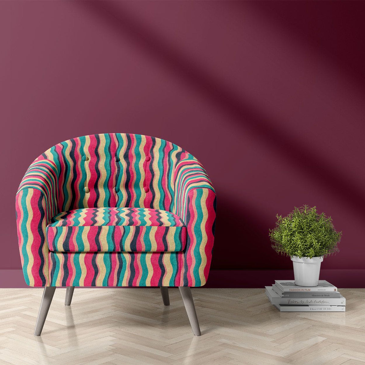Striped No.16 coral pink, teal, charcoal and sand wave stripe Crib5 velvet upholstery fabric shown on a statement chair