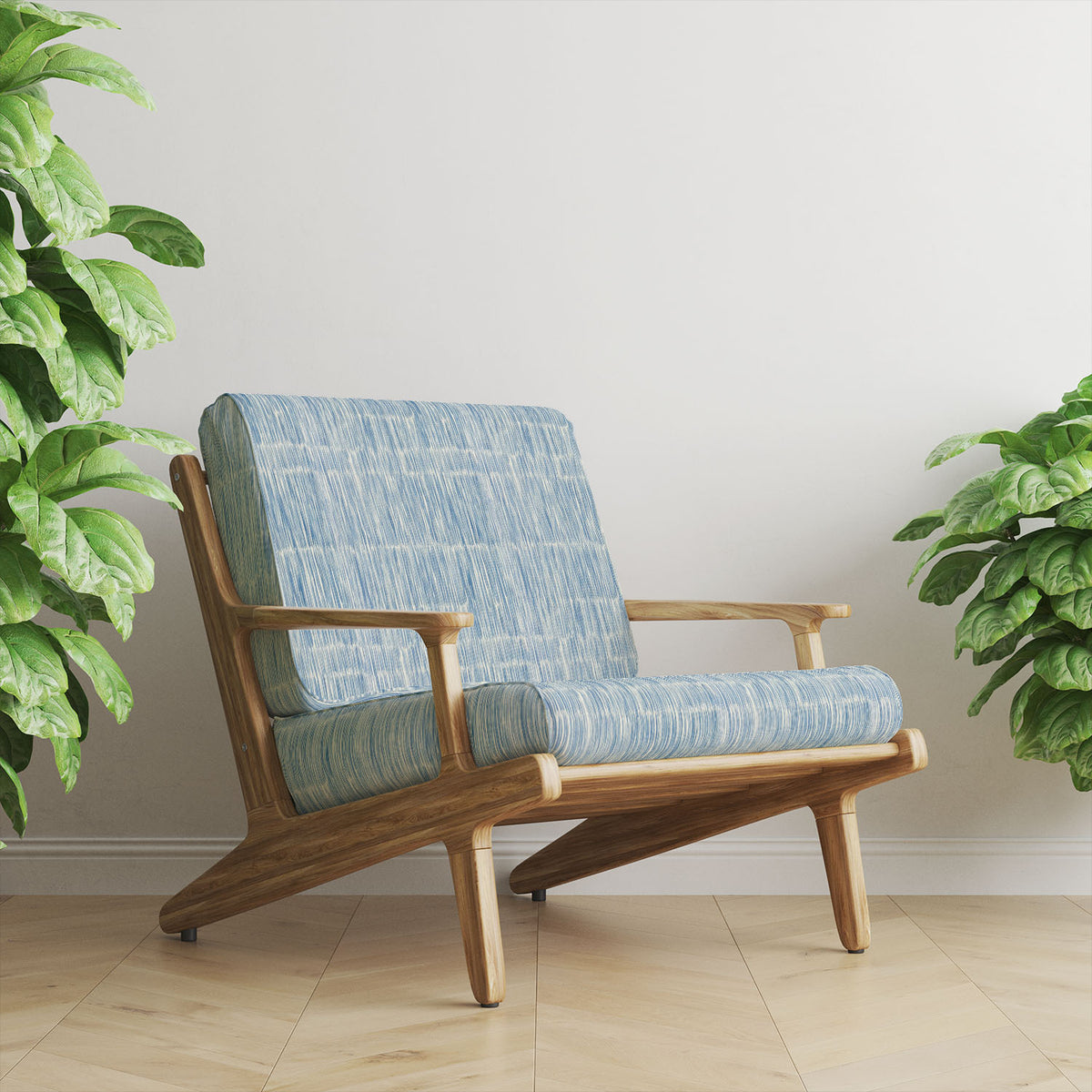 Striped No.23 denim blue and ivory hand-drawn stripe Crib5 velvet upholstery fabric shown on a statement chair