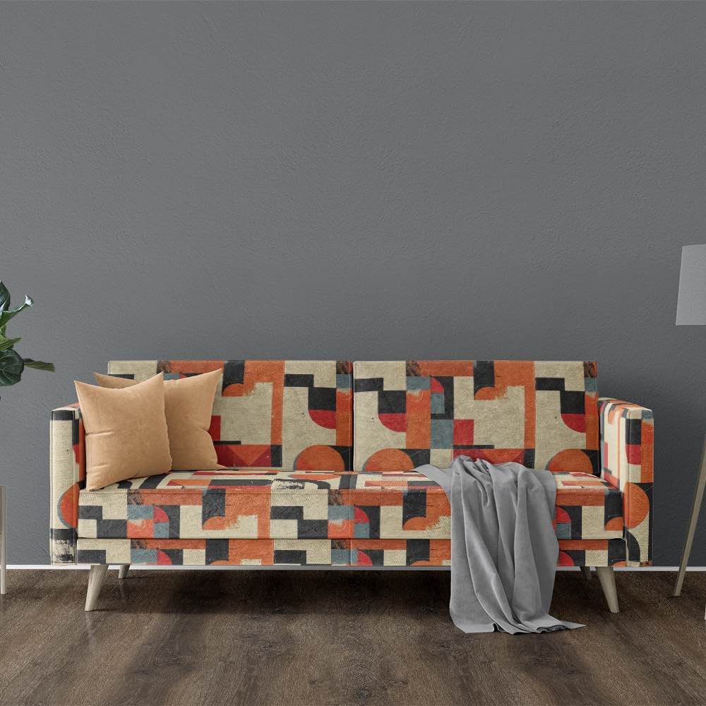 Modern sofa upholstered in orange geometric patterned fabric