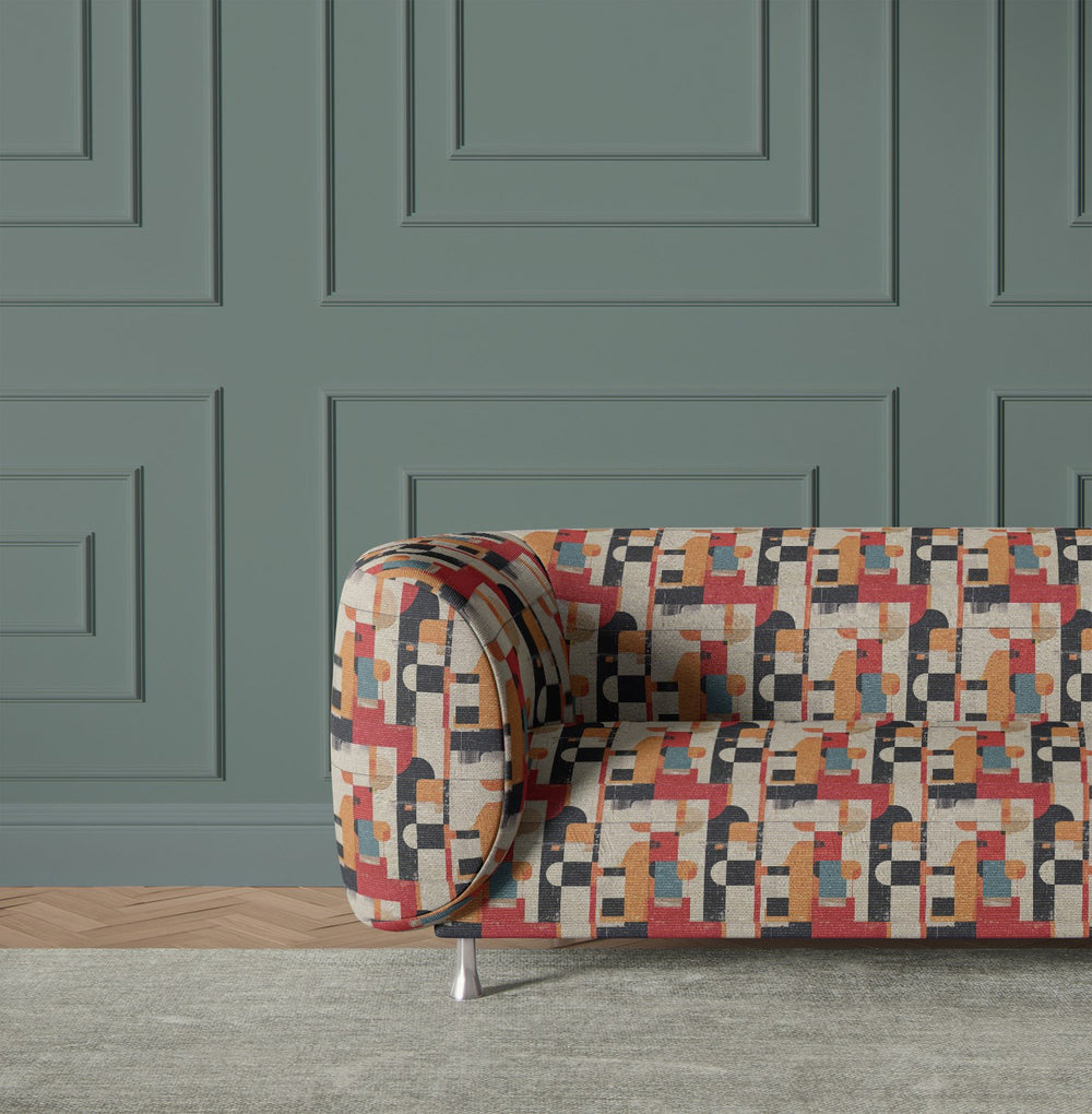Accent chair upholstered in bold geometric multicoloured fabric