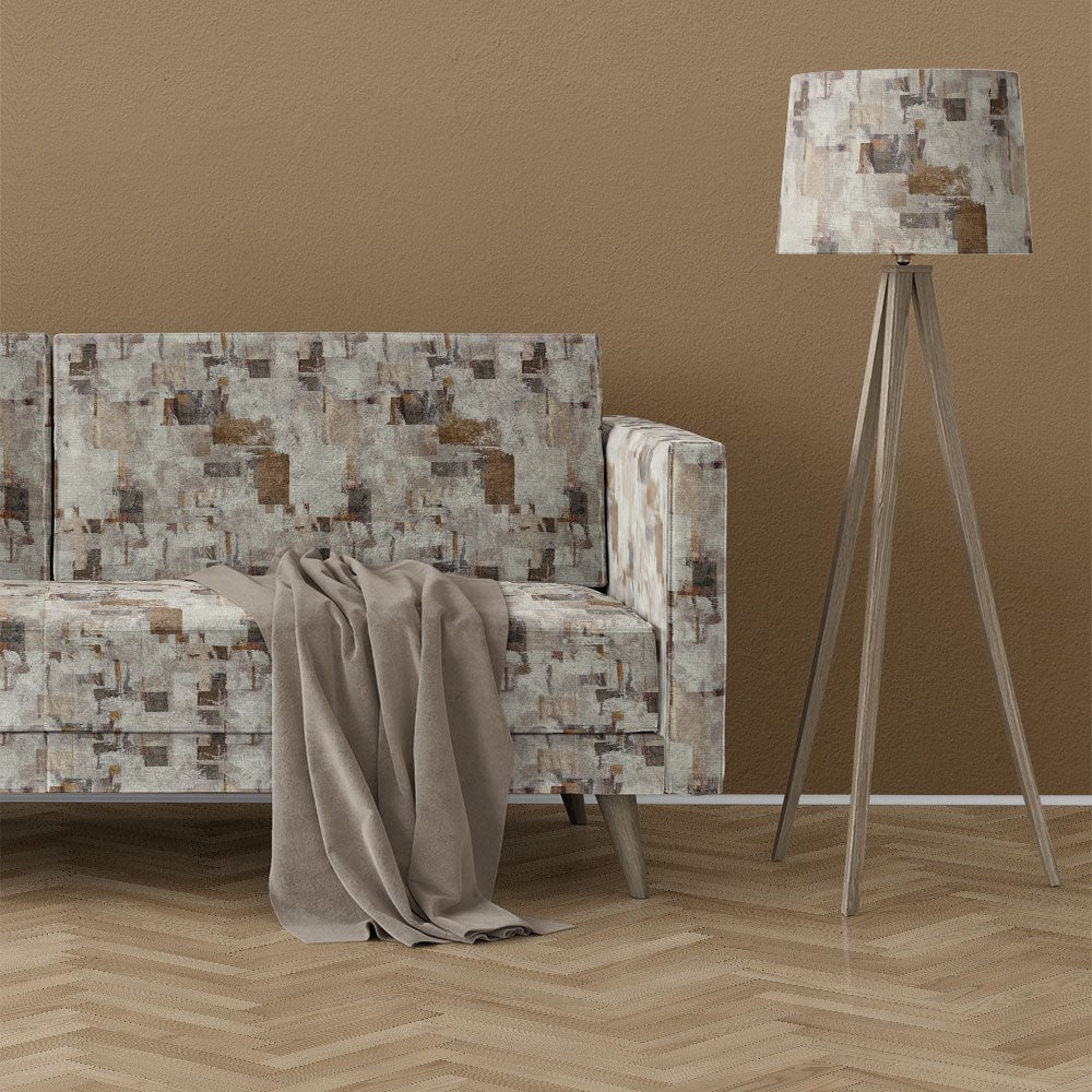 neutral brown upholstery fabric on sofa featuring a printed layered texture design with earthy tones and soft distressed finish
