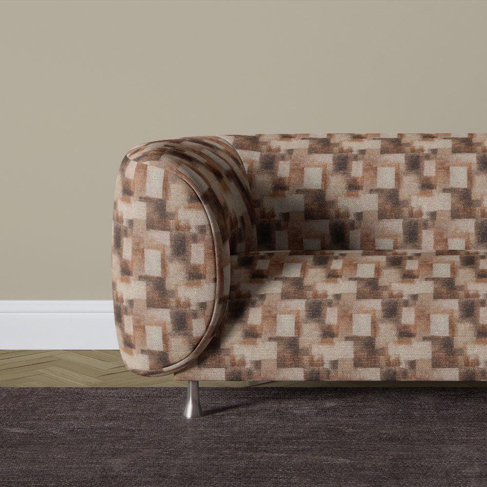 Texture No.5 brown upholstery fabric on sofa showing abstract block pattern in warm neutral tones with soft printed texture finish