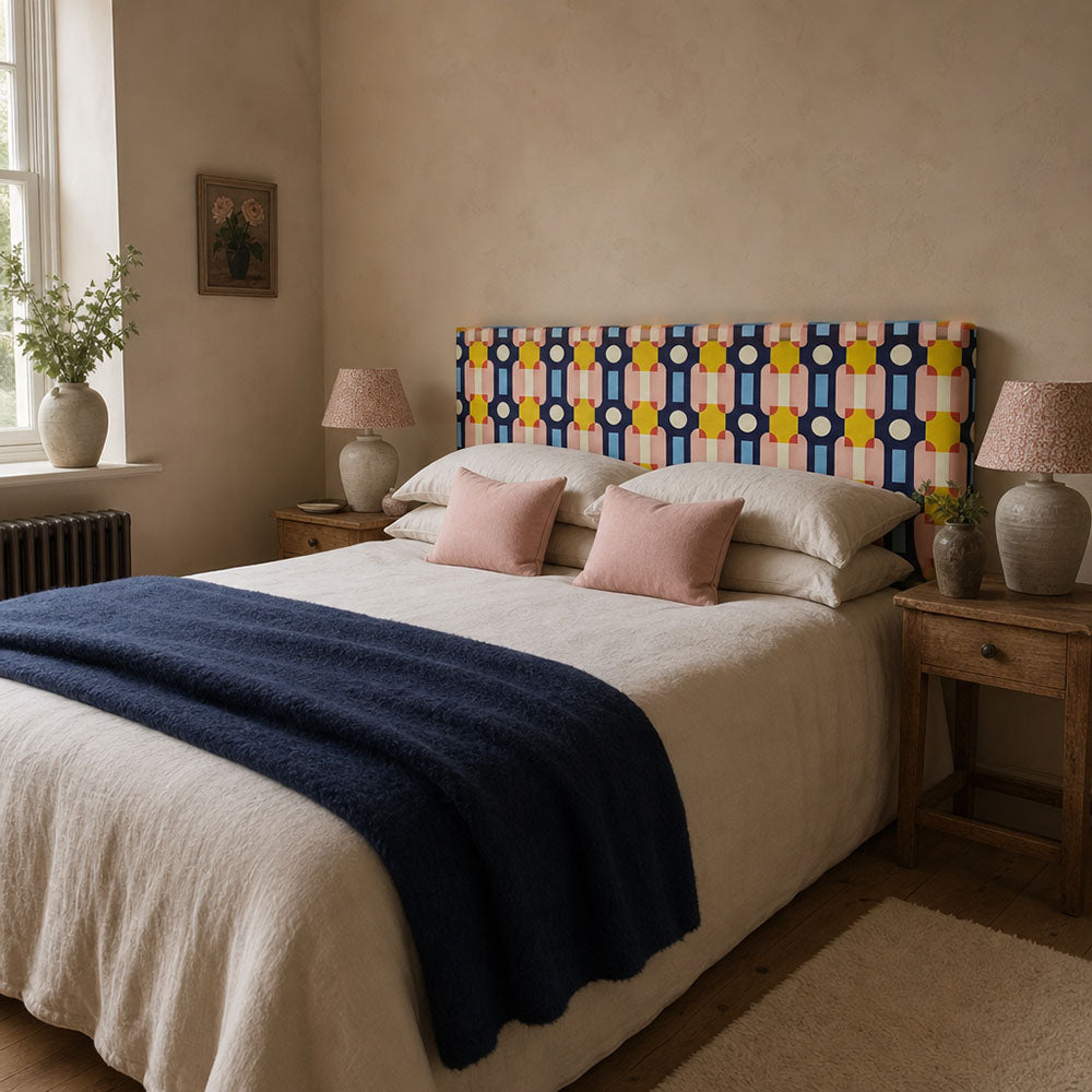 Headboard upholstered in Weimar No.3 Crib5 velvet fabric with bright geometric design