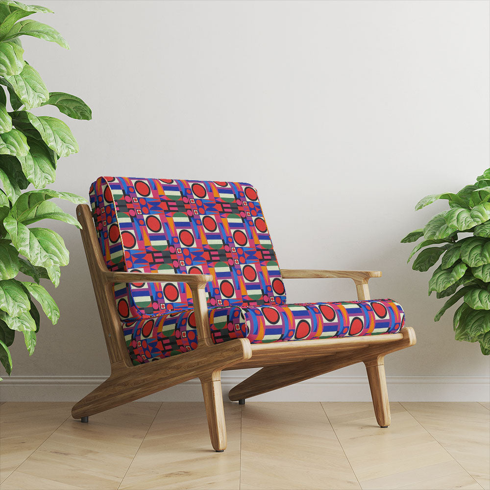 Chair upholstered in Weimar No.7 multicoloured Crib5 velvet fabric with bold geometric pattern