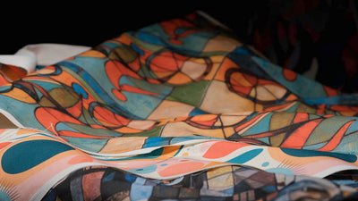 Video featuring Weimar No.3 luxury upholstery fabric in pink and blue, showcasing its retro geometric design and premium quality, ideal for statement furniture pieces.